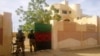 MINUSMA peacekeepers stand guard in front of the governor's office in Kidal November 15, 2013. The Tuareg rebel group MNLA officially handed control of the government buildings they occupied to United Nations peacekeepers in Kidal on Thursday. REUTERS/Str