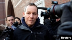 FILE - Charles Lieber leaves federal court after he was charged with lying about his alleged links to the Chinese government, in Boston, Massachusetts, Jan. 30, 2020. 