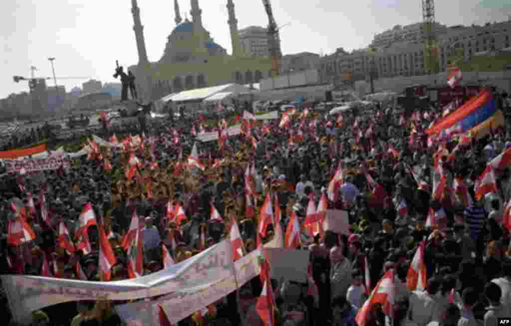 Hundreds of Lebanese of Armenian descent carry Lebanese and Armenian flags as they protest against the visit of Turkish Prime Minister Recep Tayyip Erdogan, in Beirut's Martyrs' Square, Lebanon, Thursday, Nov. 25, 2010. Lebanon has 150,000 Armenians, or n