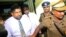 Chief of Defense Staff Admiral Ravindra Wijegunaratne is taken away by police officers from a court in Colombo, Sri Lanka, Nov. 28, 2018. 