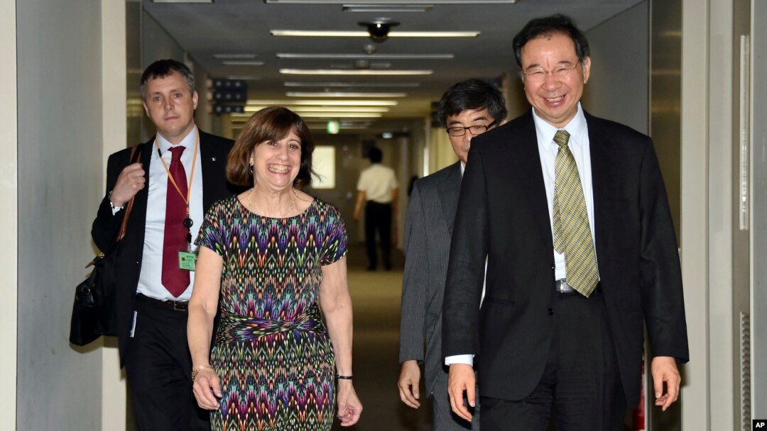 FILE - Acting Deputy U.S. Trade Representative Wendy Cutler (L) is greeted by her Japanese counterpart Hiroshi Oe (R) before their talks of the Trans-Pacific Partnership (TPP) free trade negotiations at the Foreign Ministry in Tokyo, July 9, 2015. 