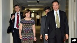 FILE - Acting Deputy U.S. Trade Representative Wendy Cutler (L) is greeted by her Japanese counterpart Hiroshi Oe (R) before their talks of the Trans-Pacific Partnership (TPP) free trade negotiations at the Foreign Ministry in Tokyo, July 2015. 