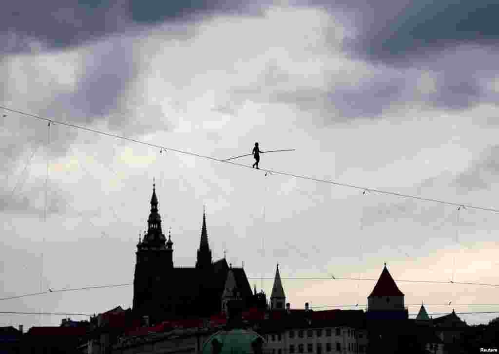 Tightrope walker Tatiana-Mosio Bongonga walks on a rope above the Prague Castle during a rehearsal for an official opening of an international circus and theater festival in Prague, Czech Republic, Aug. 13, 2019.