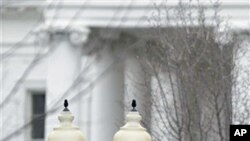 American and Chinese flags fly along Pennsylvania Avenue in front of the White House in Washington, 17 Jan 2011