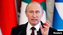 Russia's President Vladimir Putin speaks during a news conference, part of the Gas Exporting Countries Forum (GECF), at the Kremlin in Moscow, July 1, 2013. 