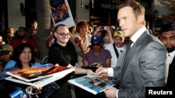 Actor Chris Pratt signs autographs at the world premiere of Marvel Studios' "Guardians of the Galaxy Vol. 2." in Hollywood, April 19, 2017.