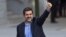 FILE - Jordi Sanchez, president of the Catalan National Assembly, waves to supporters on arrival at the national court in Madrid, Spain, Oct. 16, 2017.