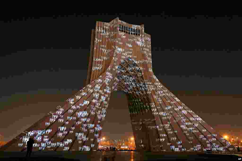 The video mapping is projected on Tehran's iconic Azadi(freedom) tower to commemorate 176 victims of the Ukrainian flight during a municipal memorial marking the first anniversary of the plane crash, in Tehran, Iran.