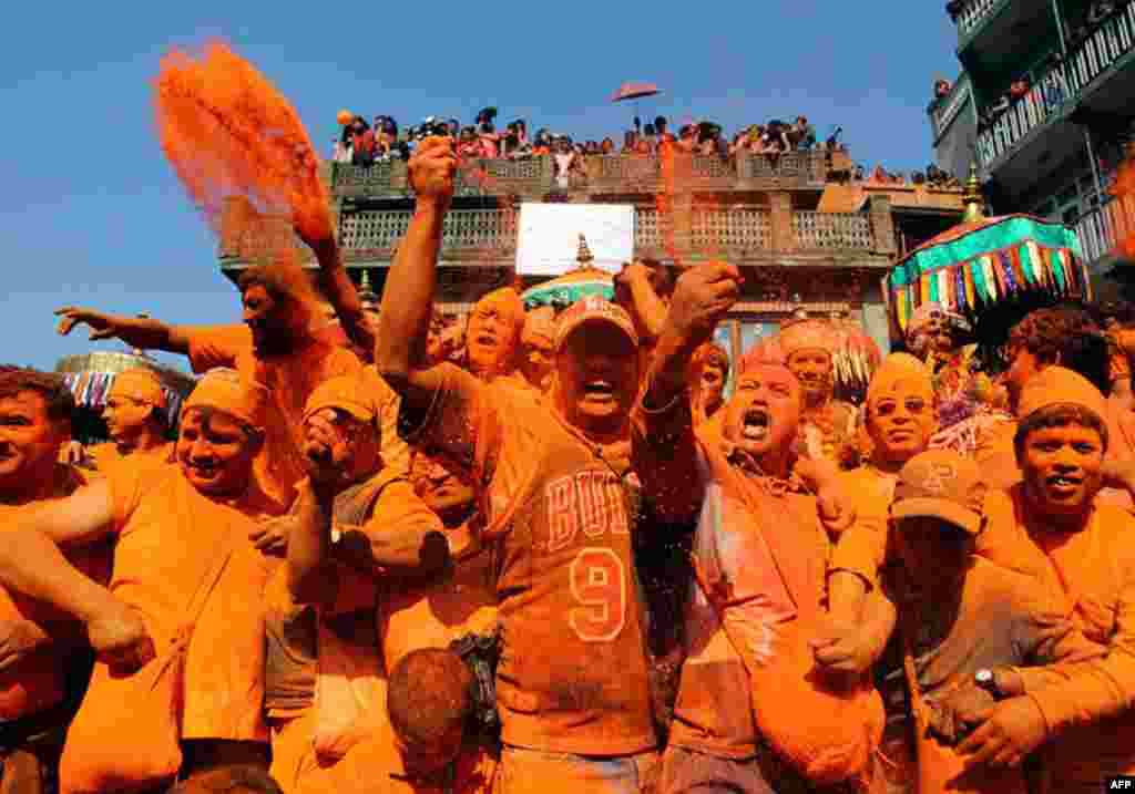 April 15: People throw vermillion powder on one another to celebrate the Nepali New Year, also known as "Sindoor Jatra" at Thimi, near Kathmandu. (Reuters/Navesh Chitrakar)