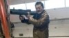 Takeshi Ebisawa poses with a rocket launcher during a meeting with an informant and two undercover Danish police officers at a warehouse in Copenhagen, Denmark, Feb. 3, 2021, in a photograph from a criminal complaint. (Southern District of New York/Handout via Reuters). 