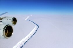 FILE - A rift across the Larsen C Ice Shelf is seen during an airborne survey of changes in polar ice over the Antarctic Peninsula from NASA’s DC-8 research aircraft, Nov. 10, 2016.