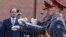 Egyptian President Abdel Fattah el-Sissi, left, attends a wreath laying ceremony at the Tomb of the Unknown Soldier in Moscow, Oct. 16, 2018.