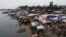 FILE - A view of temporary shelters for typhoon survivors that were constructed next to a ship that ran aground is pictured nearly 100 days after super Typhoon Haiyan devastated Tacloban city in central Philippines, Feb. 14, 2014. 