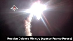 This handout video grab released, Nov. 29, 2021, shows the launch of a new Zircon hypersonic cruise missile from the the Admiral Gorshkov warship at a target in the Barents Sea.