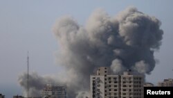 FILE - Smoke rises after Israeli strikes, amid the ongoing conflict between Israel and Palestinian Islamist group Hamas, in Gaza City November 6, 2023.