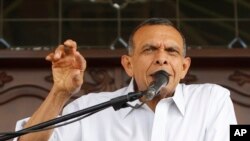 FILE - Former Honduran President Porfirio Lobo speaks outside his home in Tegucigalpa, March 7, 2017.
