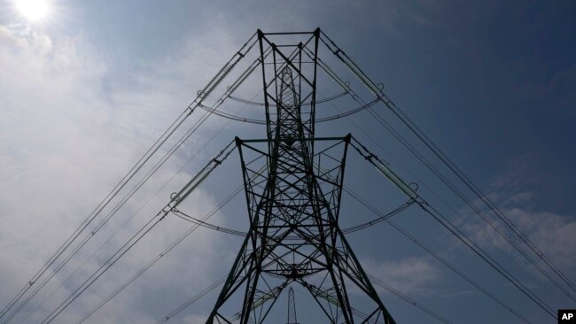 FILE - An electricity pylon is seen in Lydd, southern England, Monday, Aug. 15, 2022. (AP Photo/Frank Augstein, file)