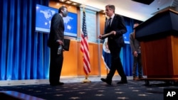 FILE - Secretary of State Antony Blinken, right, and International Religious Freedom Senior Official Dan Nadel, left, depart after a news conference to announce the annual International Religious Freedom Report at the State Department, May 12, 2021.