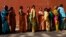 FILE - Women line up to cast their votes outside a polling station during the seventh phase of India's general election at Howrah district in the eastern Indian state of West Bengal, April 30, 2014. 