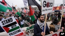 FILE—Pro-Palestinian demonstrators march during a visit by President Joe Biden in Warren, Mich., February 1, 2024.
