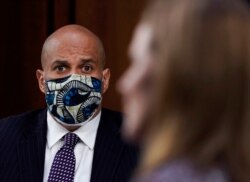 Sen. Cory Booker, D-N.J., listens during the confirmation hearing for Supreme Court nominee Amy Coney Barrett before the Senate Judiciary Committee Oct. 14, 2020, on Capitol Hill in Washington.