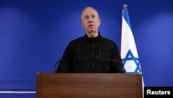 FILE - Former Israeli Defense Minister Yoav Gallant speaks to members of the press at the Ministry of Defense in Tel Aviv, Israel, Nov. 5, 2024. 