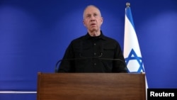 Former Israeli Defense Minister Yoav Gallant speaks to members of the press shortly after he was fired by Israeli Prime Minister Benjamin Netanyahu, who cited a lack of trust, at the Ministry of Defense in Tel Aviv, Israel, Nov. 5, 2024.