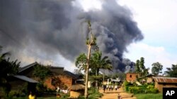 Smoke from the United Nations compound rises in Beni, Democratic Republic of Congo, Nov. 25, 2019.