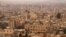 A general view shows the Old City of Aleppo as seen from Aleppo's historic citadel, Syria, Dec. 11, 2009. A similar view is seen below from Oct. 2016. 