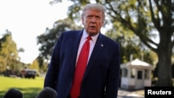 U.S. President Donald Trump talks to reporters as he departs for campaign travel to Ohio from the South Lawn at the White House in Washington, Sept. 21, 2020. 