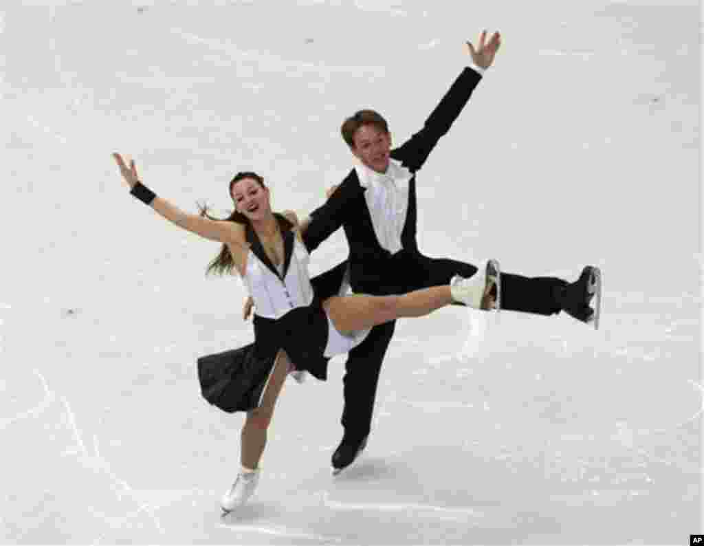 Tanja Kolbe and Stefano Caruso of Germany compete in the ice dance short dance figure skating competition at the Iceberg Skating Palace during the 2014 Winter Olympics, Sunday, Feb. 16, 2014, in Sochi, Russia. (AP Photo/Ivan Sekretarev)