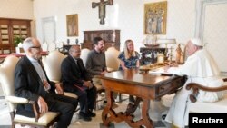 FILE - Pope Francis meets with the delegation of the movement Laudato Si at the Vatican, November 6, 2023.