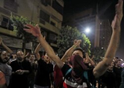Small groups of protesters gather in central Cairo, shouting anti-government slogans in Cairo, Egypt, Sept. 21, 2019.