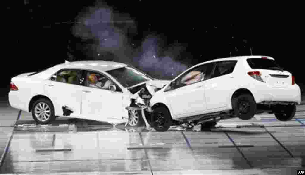Toyota cars crash during a collision test in a demonstration of its safety technology at its facility in Susono, near Mount Fuji, Japan, Thursday, July 21, 2011. Toyota is developing a safety technology that takes control of the steering so the vehicle ca