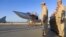 In this photo taken from video provided May 25, 2021, by the Russian Defense Ministry Press Service, crew members exit a Russian Tu-22M3 bomber upon its landing at Hmeimim air base in Syria.