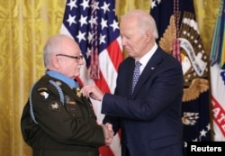 U.S. President Joe Biden awards the Medal of Honor to then-Private First Class Kenneth J. David for actions in the Vietnam War, during a ceremony at the White House in Washington, Jan. 3, 2025.