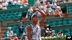 Venus Williams celebrates winning 6-3, 6-1, against Japan's Kurumi Nara during their second round match of the French Open tennis tournament at the Roland Garros stadium, in Paris, May 31, 2017.