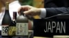 Japanese sake, listed as a nominee for Intangible Cultural Heritage, is displayed on Japan's delegation table during an UNESCO World Heritage Convention, in Asuncion, Paraguay, Dec. 4, 2024. 