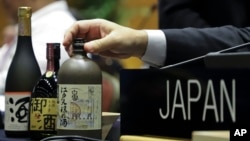 Japanese sake, listed as a nominee for Intangible Cultural Heritage, is displayed on Japan's delegation table during an UNESCO World Heritage Convention, in Asuncion, Paraguay, Dec. 4, 2024. 