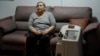 Cancer patient Linda Vidal, who relies on an electricity-powered oxygen concentrator to breathe properly, sits for an interview to talk about her physical and mental health amid the electricity cuts, in Quito, Ecuador, Oct. 24, 2024.