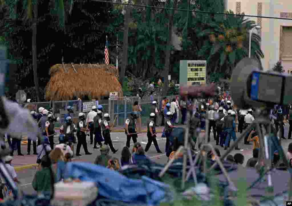FILE - Police in riot gear move into the streets during demonstrations at Flamingo Park during the Republican National Convention, in Miami, Fla., August 1972. 