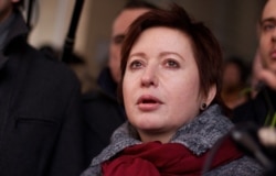 FILE - Olga Romanova, a Russian journalist and opposition activist, is pictured in Moscow, March 15, 2012.