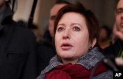 FILE - Olga Romanova, a Russian journalist and opposition activist, is pictured in Moscow, March 15, 2012.