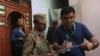A census enumerator, right, along with a Pakistan Army soldier notes details outside a house during Pakistan’s sixth population census in Karachi, Pakistan March 15, 2017.