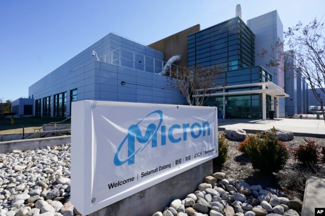 FILE - A sign marks the entrance of the Micron Technology automotive chip manufacturing plant on Feb. 11, 2022, in Manassas, Va. (AP Photo/Steve Helber, File)