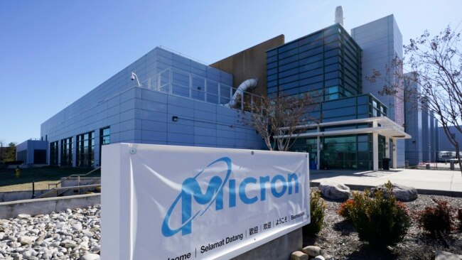 FILE - A sign marks the entrance of the Micron Technology automotive chip manufacturing plant on Feb. 11, 2022, in Manassas, Va. (AP Photo/Steve Helber, File)