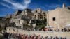 The pack of cyclists pedals past Matera at the start of the seventh stage of the Giro d&#39;Italia cycling race, from Matera to Brindisi, southern Italy.