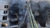 Firefighters work to extinguish a blaze in a residential apartment building following a Russian strike, in Kharkiv, northeastern Ukraine, Sept. 15, 2024.