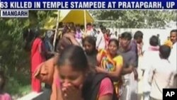 Video grab from Headlines Today television channel shows an Indian woman crying at the scene of a stampede in Pratapgarh, southeast of New Delhi, 04 Mar 2010