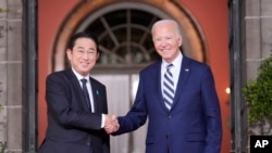 President Joe Biden greets Japan's Prime Minister Fumio Kishida at the Quad leaders summit at Archmere Academy in the U.S. state of Delaware, Sept. 21, 2024.